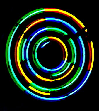 Abstract Concentric Neon Light Circles on Black Background