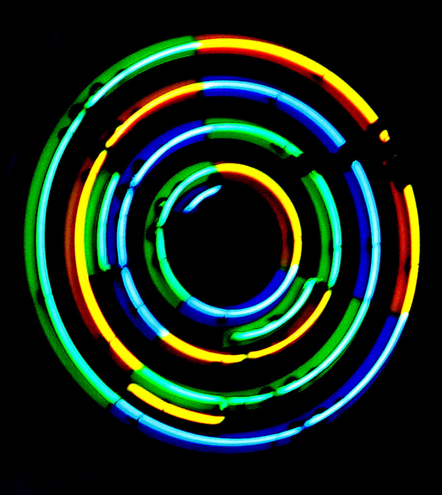 Abstract Concentric Neon Light Circles on Black Background