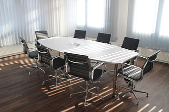 Modern Empty Conference Room with White Table and Black Chairs