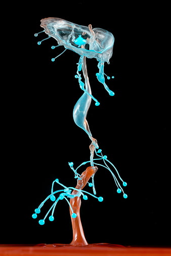 Abstract blue and orange liquid splash on black background
