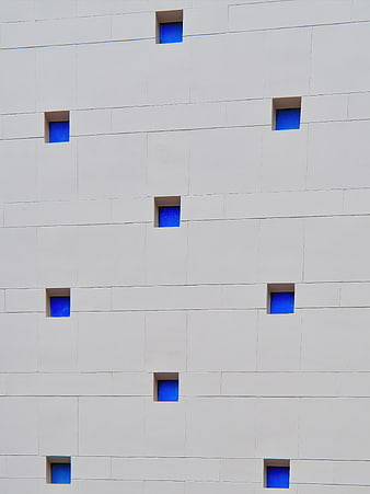 Modern White Building Facade with Blue Windows