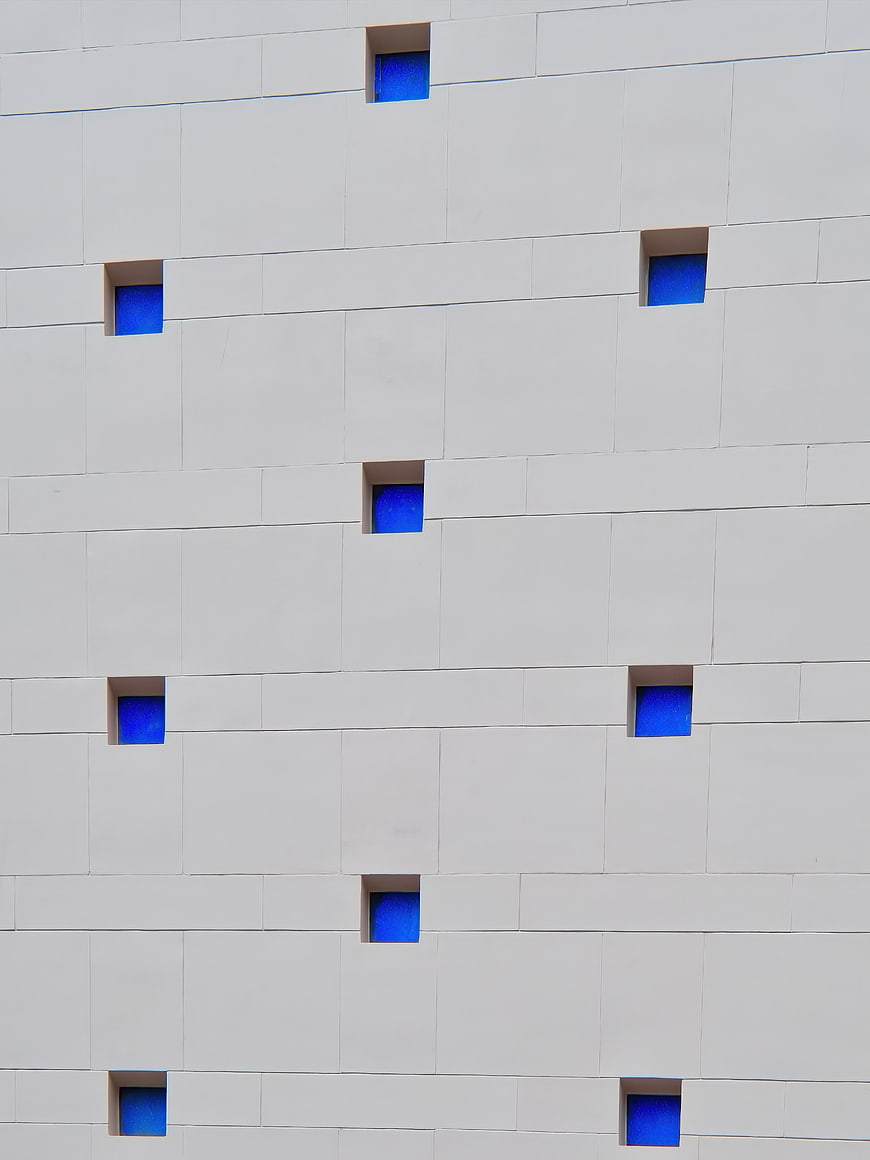 Modern White Building Facade with Blue Windows