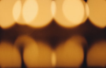 Abstract warm golden bokeh background with soft light circles