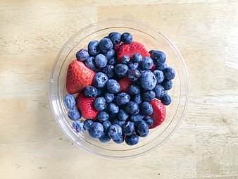 Fresh Blueberries and Strawberries in Clear Plastic Bowl