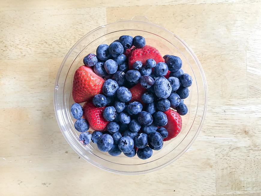 Fresh Blueberries and Strawberries in Clear Plastic Bowl