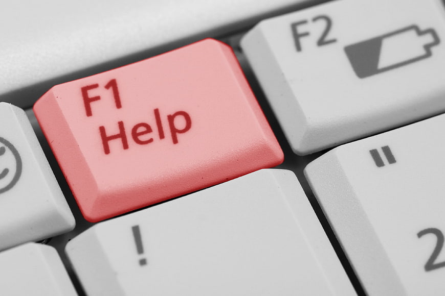 Red F1 Help Key on White Computer Keyboard Close-Up