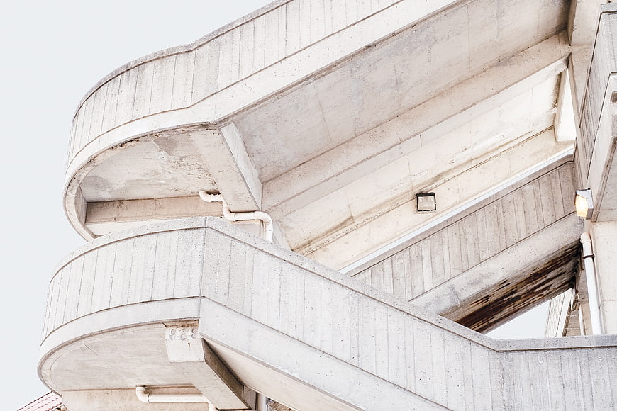 Low angle view of weathered concrete building architecture