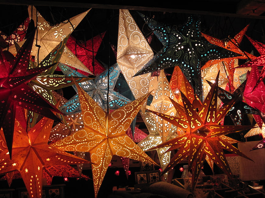 Colorful Star Lanterns Hanging In A Nighttime Market