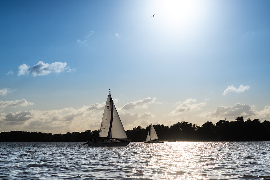 Sailboats on a Lake with Sunlight Reflections