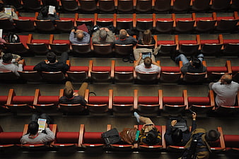 High angle view of audience in red auditorium seats