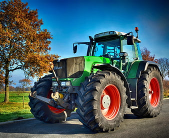 Green Fendt Tractor With Red Wheels Parked On Country Road
