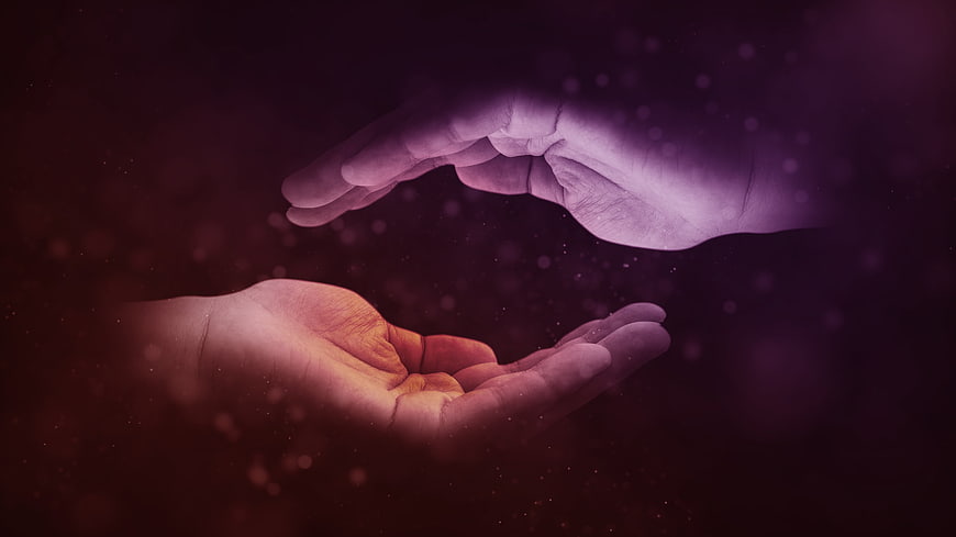 Two Hands Reaching Out in Purple and Orange Light