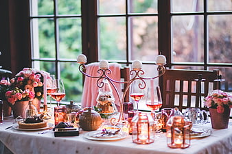 Elegant Christmas Table Setting with Pink Roses and Candles