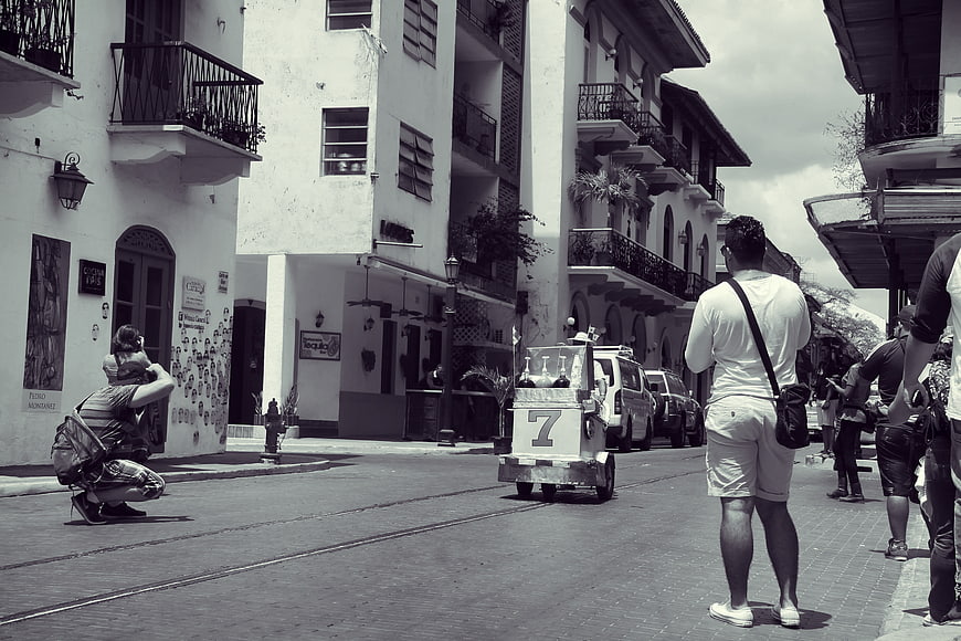 Street scene in Panama City with photographer and go-kart