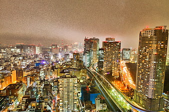 Tokyo Night Skyline with Illuminated Skyscrapers and Highway