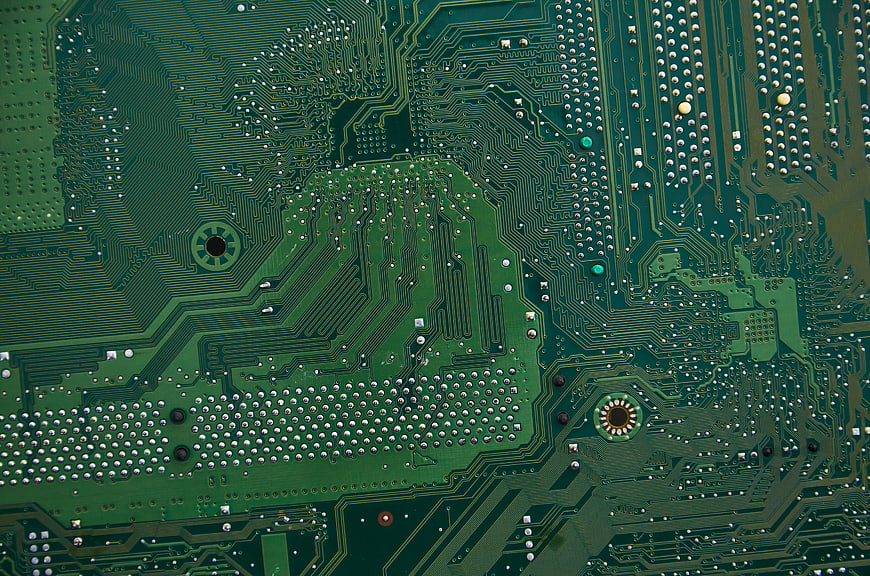 Close-up of Green Computer Circuit Board with Gold Traces