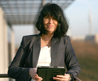 Businesswoman Holding Tablet On Outdoor Balcony