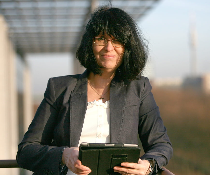 Businesswoman Holding Tablet On Outdoor Balcony