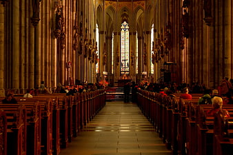 Interior of Gothic Cathedral with Congregation and Stained Glass