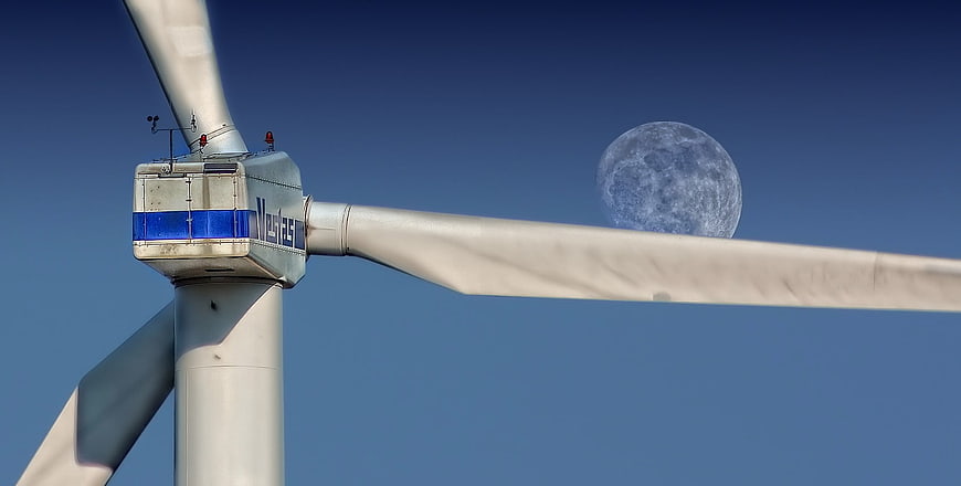 Wind Turbine Nacelle with Moon in Blue Sky