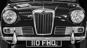 Front view of vintage Riley car in black and white