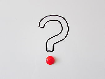 Hand-drawn question mark with red dot on white background
