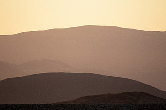 Minimalist Hazy Mountain Silhouette at Sunset