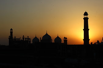 Silhouette of Mughal Fort Architecture at Golden Hour Sunset