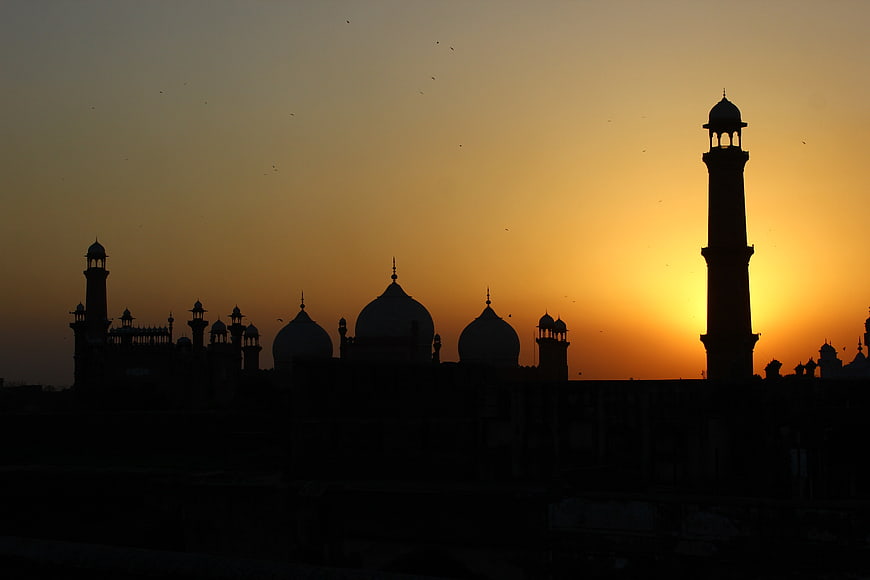 Silhouette of Mughal Fort Architecture at Golden Hour Sunset