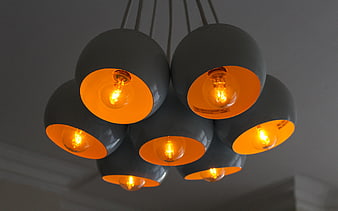 Modern grey pendant lights with warm glowing bulbs