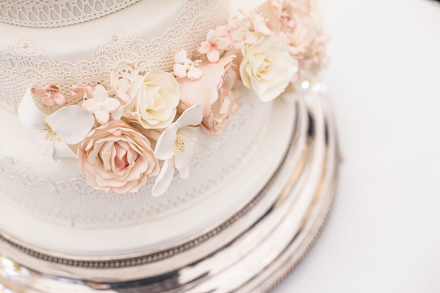 Elegant White Wedding Cake With Delicate Pink Sugar Flowers