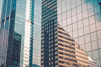 Modern glass skyscraper architecture with urban reflections