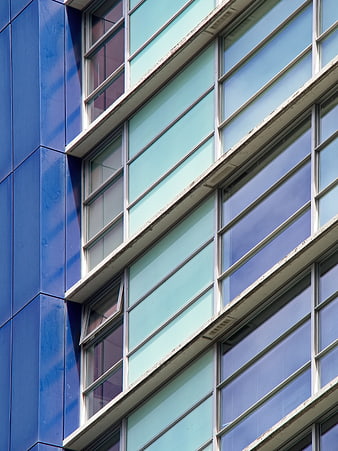 Modern Blue and Teal Office Building Facade with Windows