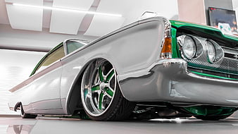 Low Angle Shot of Custom Silver and Green Lowrider Car
