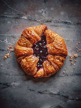 Top View of Golden Berry Jam Croissant on Dark Slate