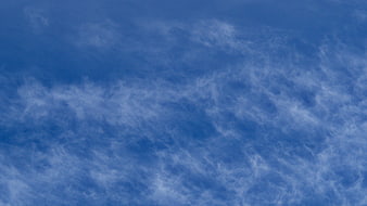 Blue Sky with Wispy Cirrus Clouds Background