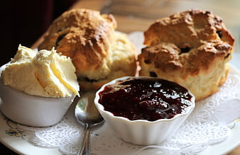 Homemade Scones With Clotted Cream And Jam On A Plate