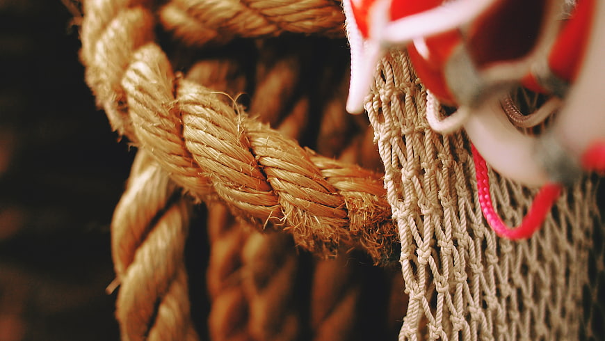 Close-up of thick nautical rope and fishing net texture