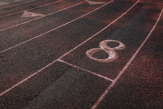 Close-up of Lane Number 8 on Red Running Track