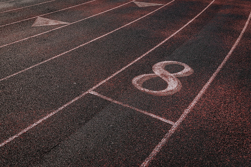 Close-up of Lane Number 8 on Red Running Track