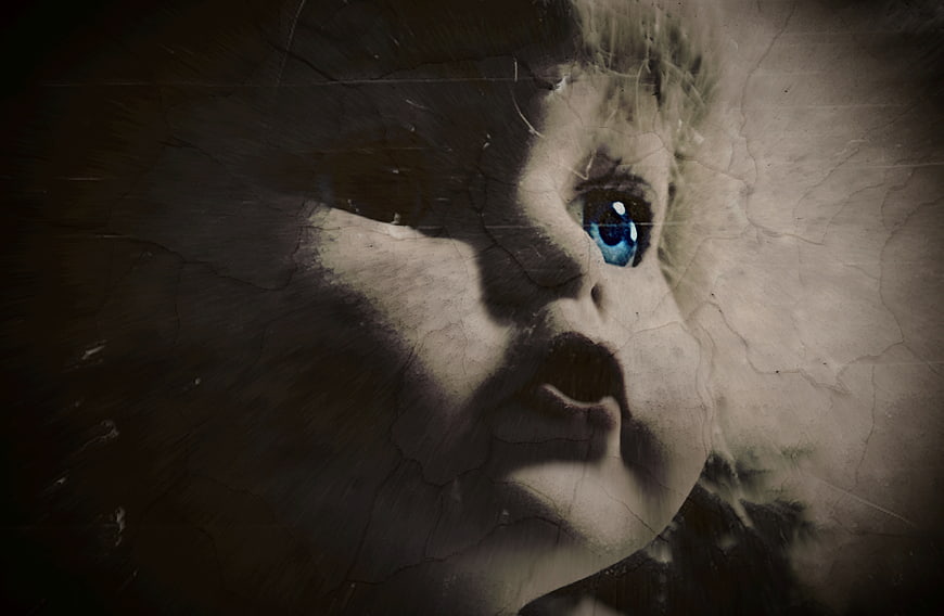 Creepy Vintage Doll Face with Blue Eye and Cracked Texture