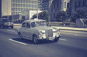 Vintage Mercedes-Benz Taxi Driving on Havana Street