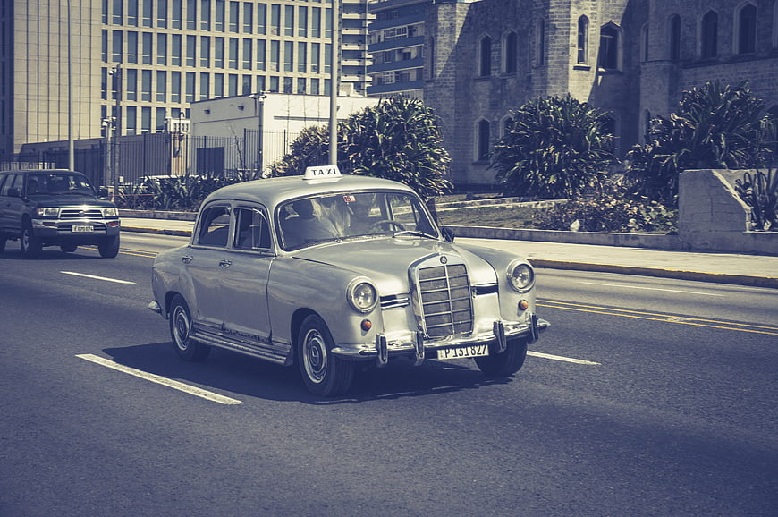 Vintage Mercedes-Benz Taxi Driving on Havana Street
