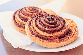 Freshly Baked Cinnamon Rolls on White Plate
