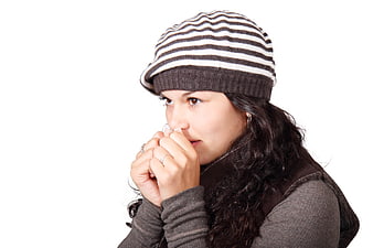 Woman in Striped Beanie Looking Sideways with Copyspace