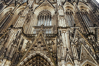 Gothic Cathedral Facade with Intricate Stone Carvings and Arched Windows