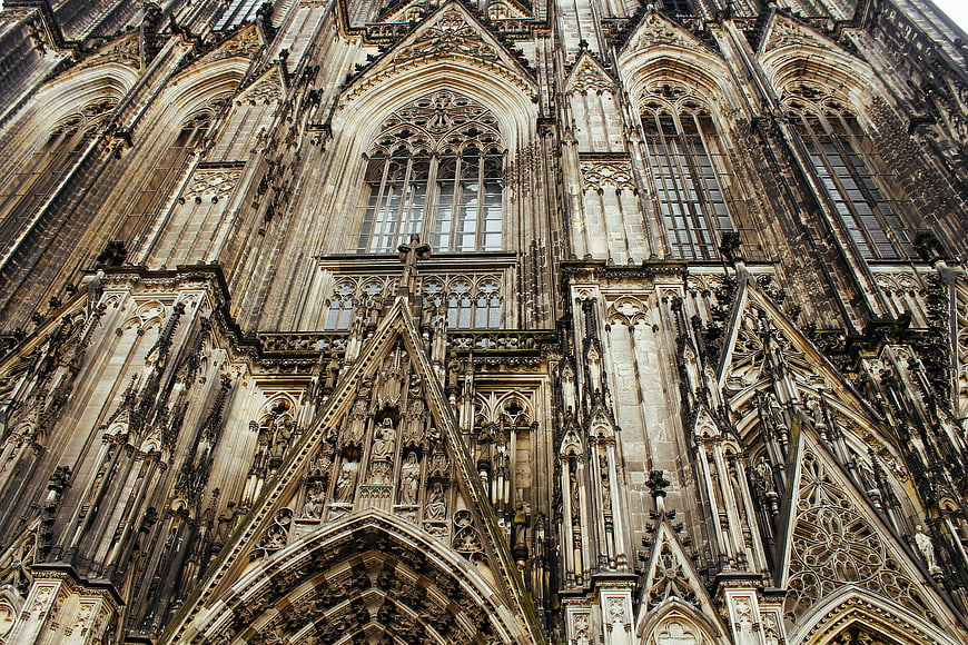 Gothic Cathedral Facade with Intricate Stone Carvings and Arched Windows