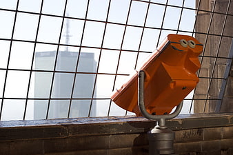 Orange Coin-Operated Binoculars on Warsaw Skyline