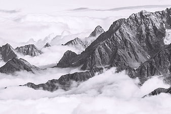 Dramatic Black and White Mountain Peaks Above Clouds