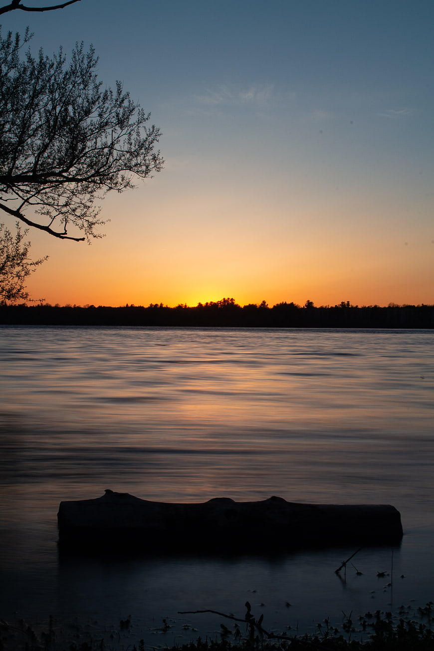 Serene Sunset Lake Landscape with Silhouette and Reflection